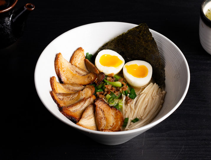Bowl of ramen with eggs, pork, seaweed, and noodles Sakana.