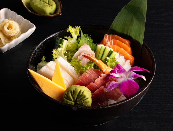 Sushi bowl with vegetables and seafood, delicious meal in restaurant
